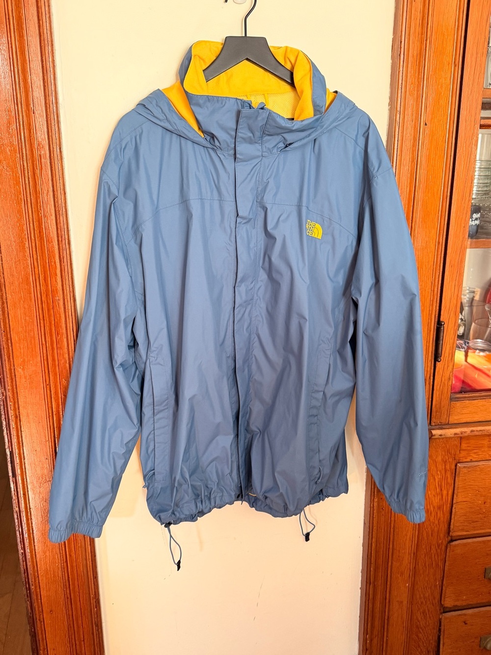 The North Face Men's Blue Rain Jacket with Yellow Hood Lining